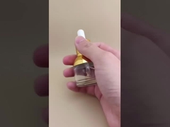 Piękna, okrągła, przejrzysta butelka na esencję