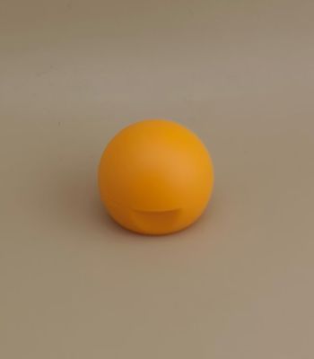 Żółta plastikowa gładka, matowa, kulista pokrywa do butelek kosmetycznych