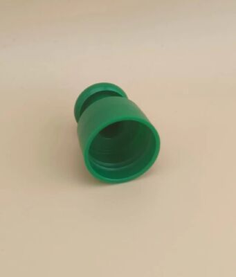 Zielona plastikowa gładka zakrętka z przyciskiem do butelek kosmetycznych