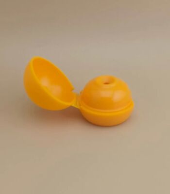 Żółta plastikowa gładka, matowa, kulista pokrywa do butelek kosmetycznych